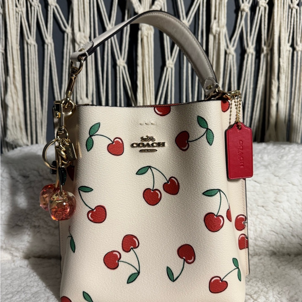Coach Cream Cherry print Mollie like new bucket Bag with red coach wallet.
